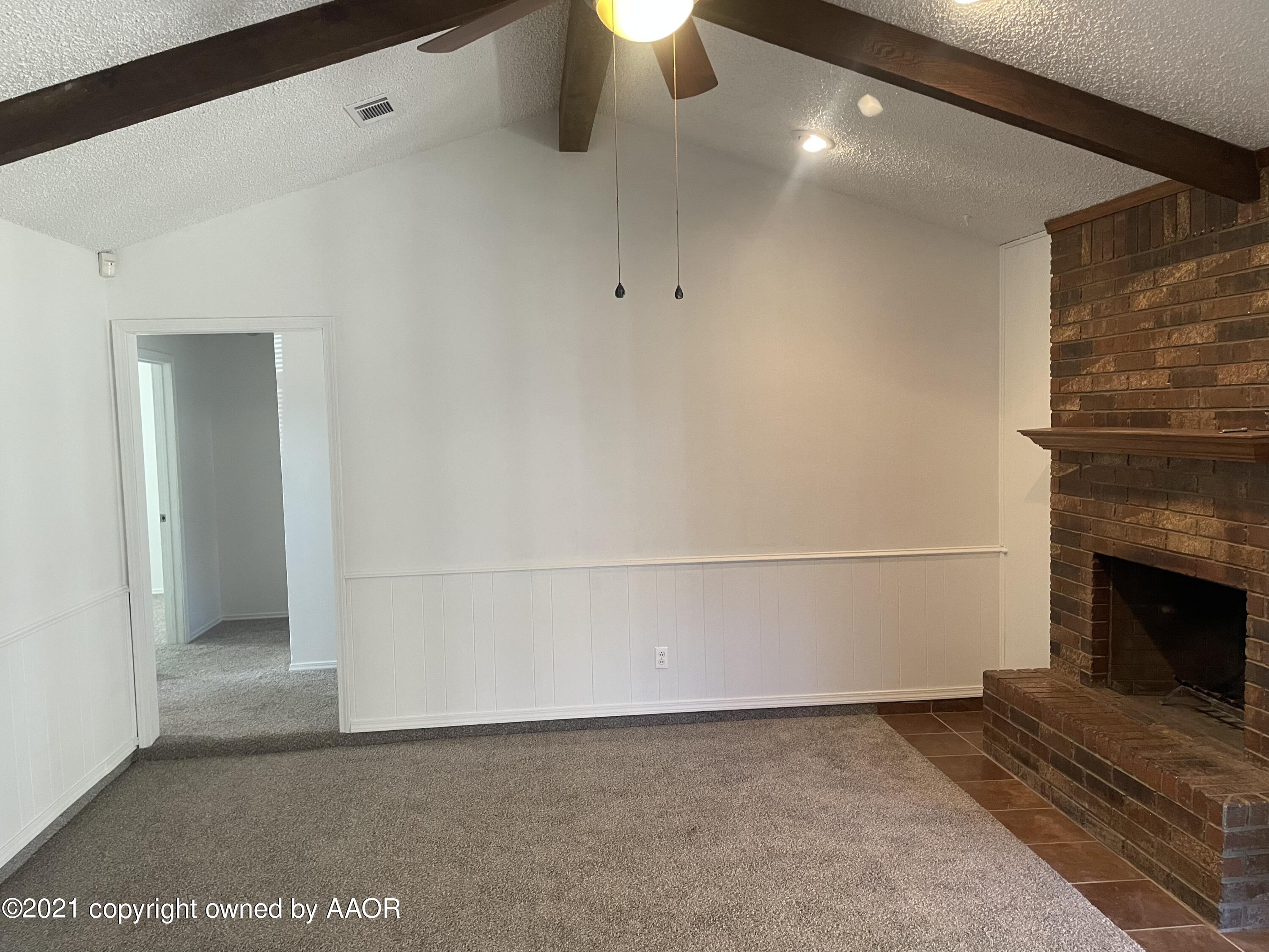 5309 Wheeler Lane Amarillo, TX 79110 - Photo 3 of 20 a view of an empty room with a fireplace