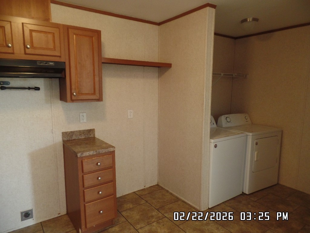 686 Ramar Road Bullhead City, AZ 86442 - Photo 11 of 22 a view of a storage and utility room with closet