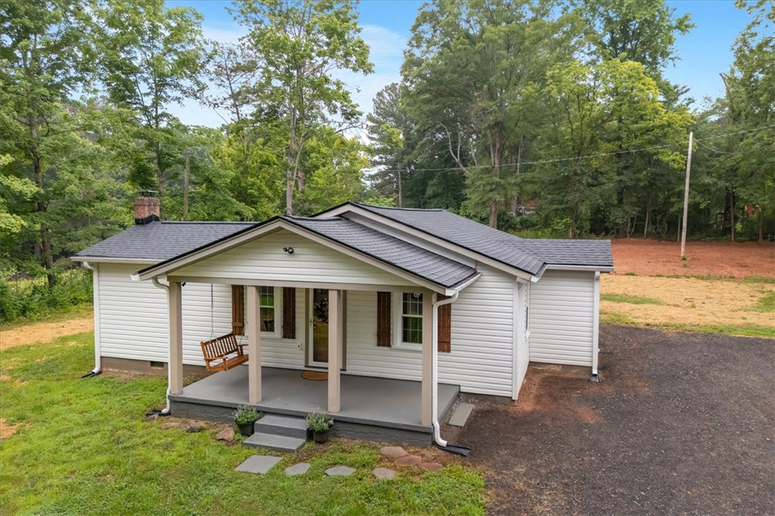 174 Holliday Road Six Mile, SC 29682 - Photo 40 of 49 A welcoming front porch features a charming wooden swing