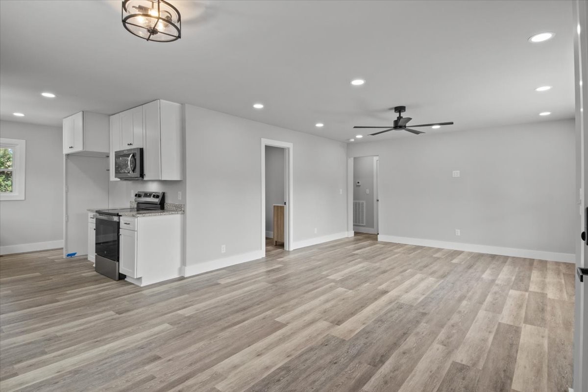 422 High Street Dickson, TN 37055 - Photo 13 of 58 a view of kitchen with wooden floor and window