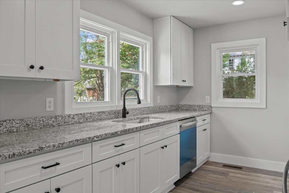 422 High Street Dickson, TN 37055 - Photo 14 of 58 a kitchen with granite countertop white cabinets and a window