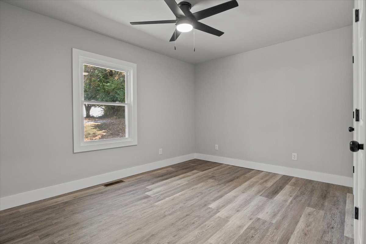 422 High Street Dickson, TN 37055 - Photo 20 of 58 a view of an empty room with wooden floor and a window
