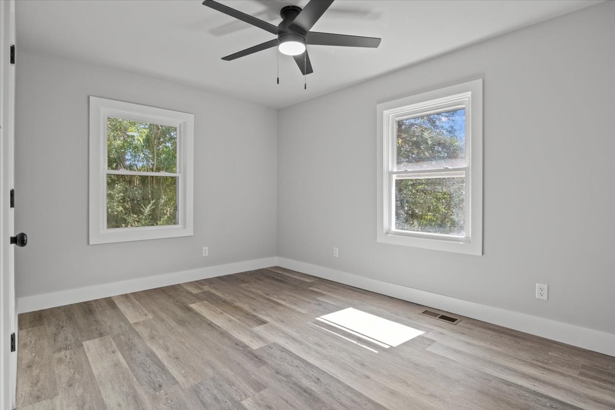 422 High Street Dickson, TN 37055 - Photo 24 of 58 a view of an empty room with a window and wooden floor
