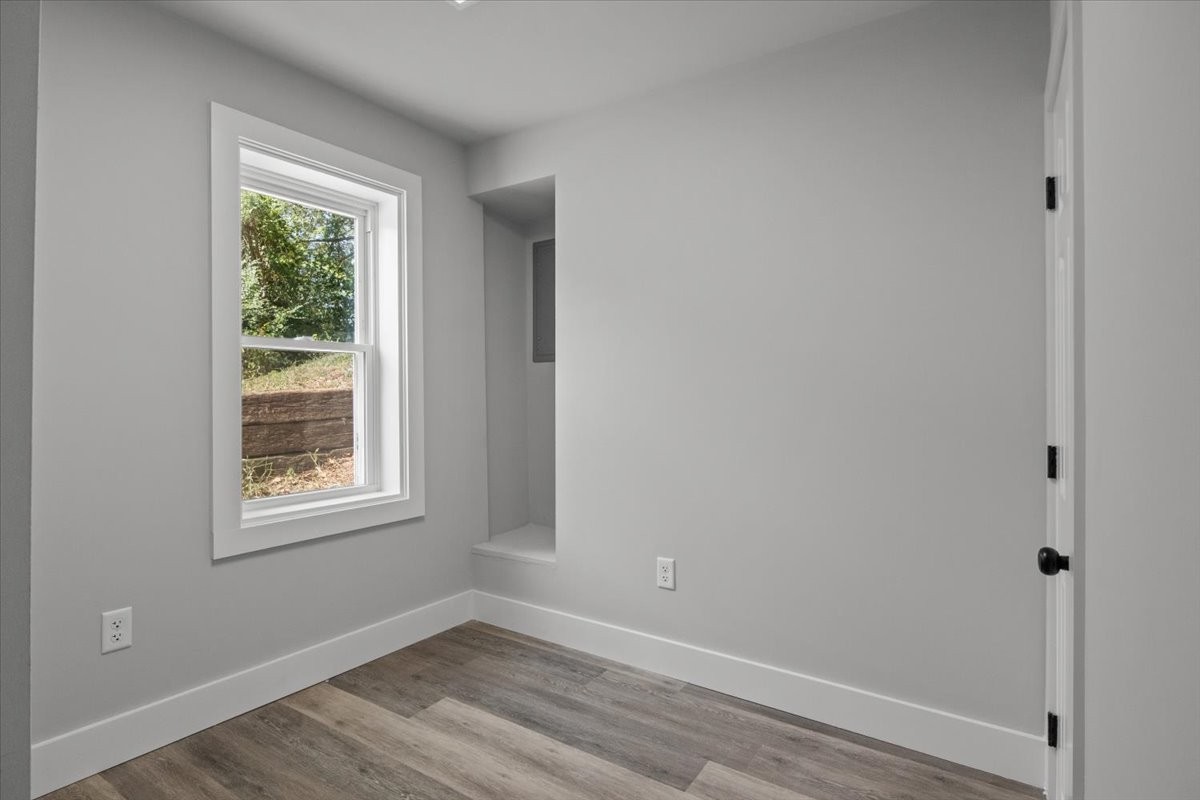 422 High Street Dickson, TN 37055 - Photo 34 of 58 a view of an empty room with wooden floor and a window
