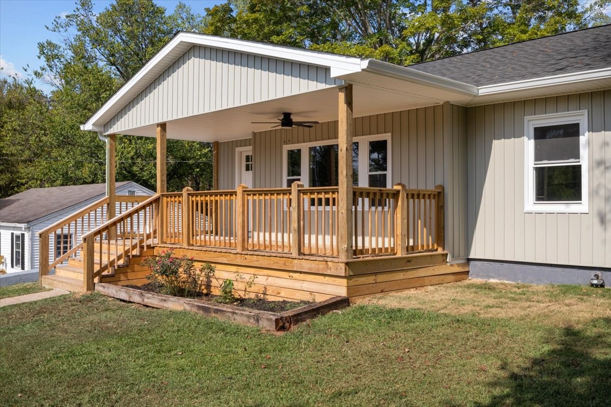422 High Street Dickson, TN 37055 - Photo 5 of 58 a view of a house with a small yard and deck