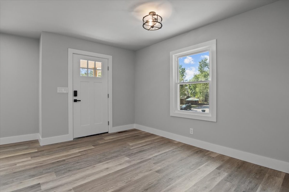 422 High Street Dickson, TN 37055 - Photo 8 of 58 an empty room with wooden floor and windows