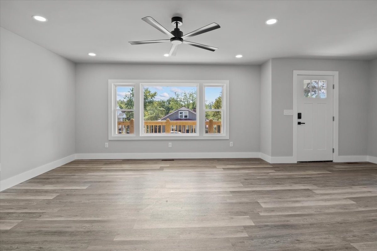 422 High Street Dickson, TN 37055 - Photo 9 of 58 a view of an empty room with a window and a ceiling fan