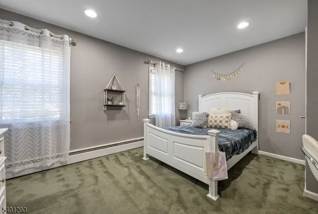 a bed room with a bed and window