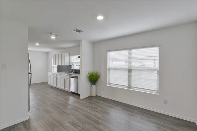 a view of kitchen and windows