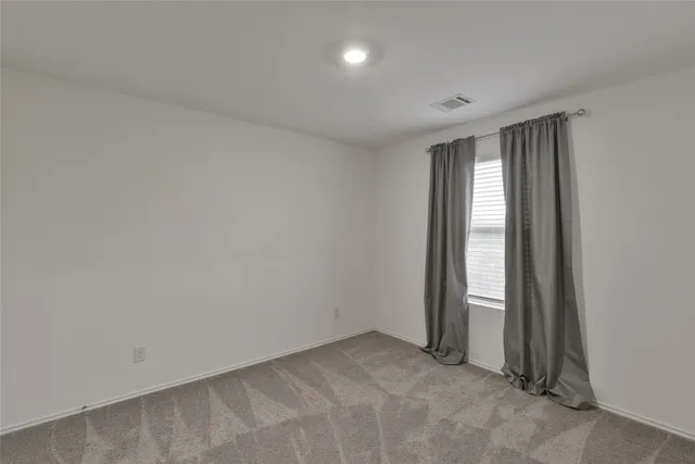 an empty room with sliding door