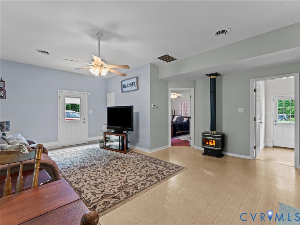 3420 State Rte 656 Powhatan, VA 23139 - Photo 28 of 37 a living room with furniture and a flat screen tv