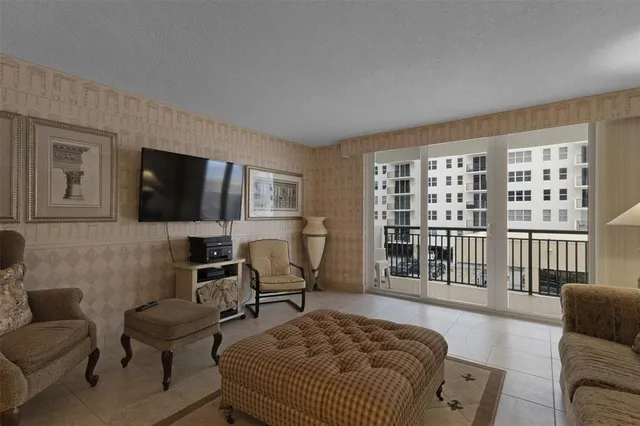 a bedroom with furniture wooden floor and windows