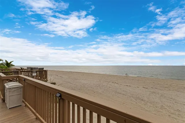 a view of a balcony with furniture