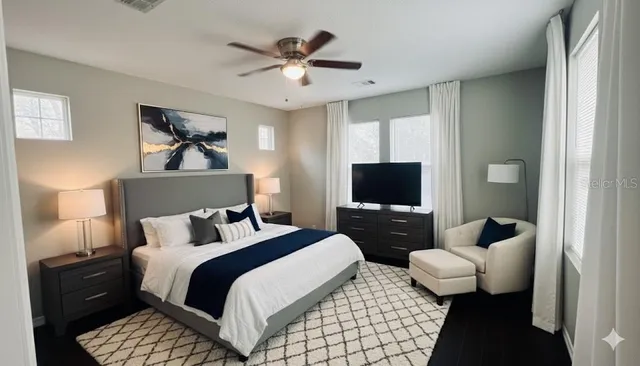 a bedroom with a bed and a couch