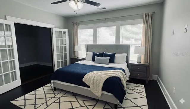 a bedroom with a bed and window