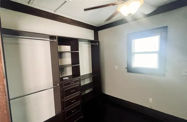 a room with closet and wooden floor