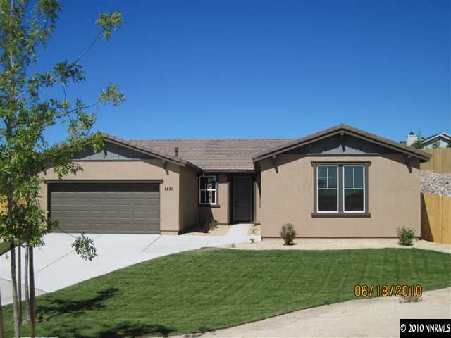 1491 Hogadon Way Reno, NV 89523 - Photo 1 of 5 a front view of a house with a yard