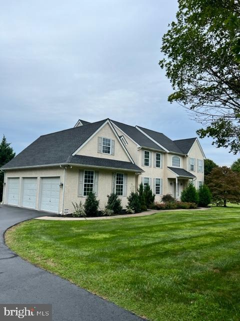 271 West Branch Road Oxford, PA 19363 - Photo 1 of 42 a front view of a house with a garden and trees