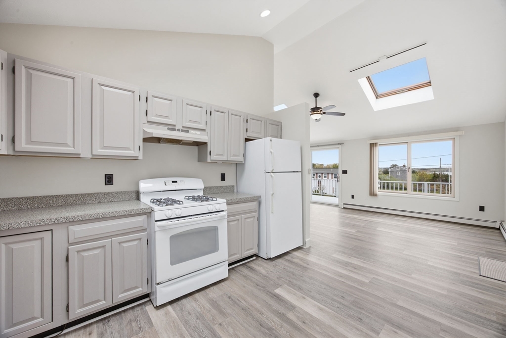 192 Swifts Beach Road Wareham, MA 02571 - Photo 19 of 38 a kitchen with white cabinets and white appliances