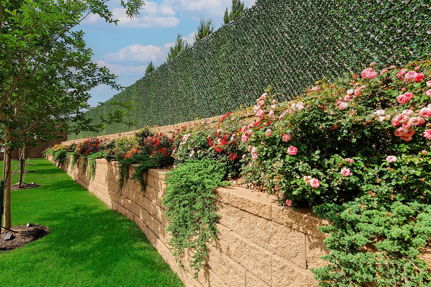 2017 Bennet Lane Conroe, TX 77384 - Photo 2 of 48 A private garden retreat framed by terraced rose beds and meticulously maintained landscaping