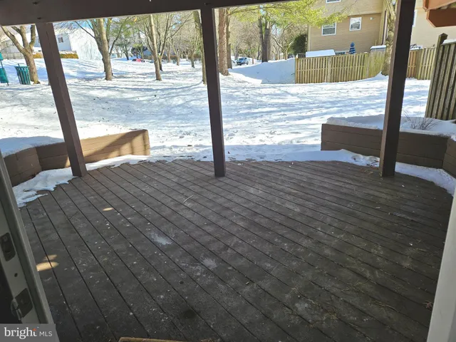 a view of porch with wooden floor