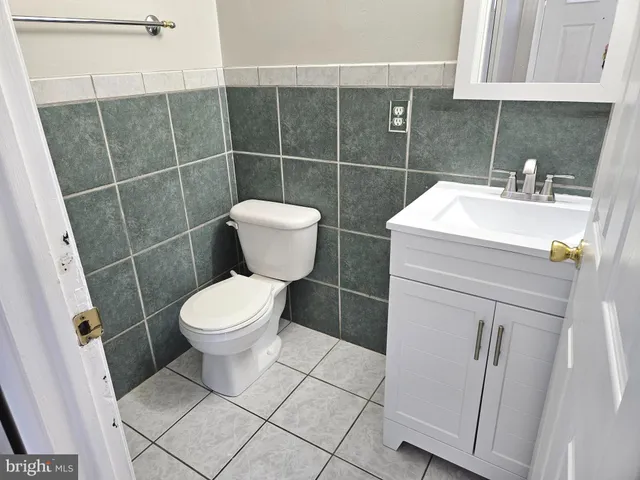 a bathroom with a toilet sink and shower