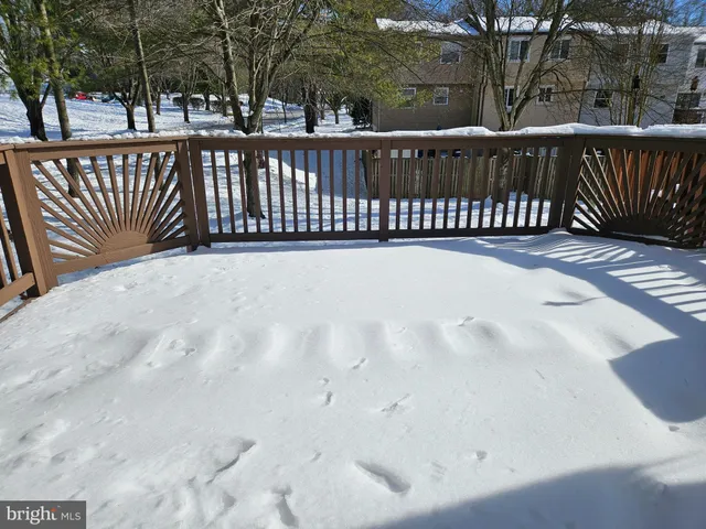 a view of a roof with wooden fence