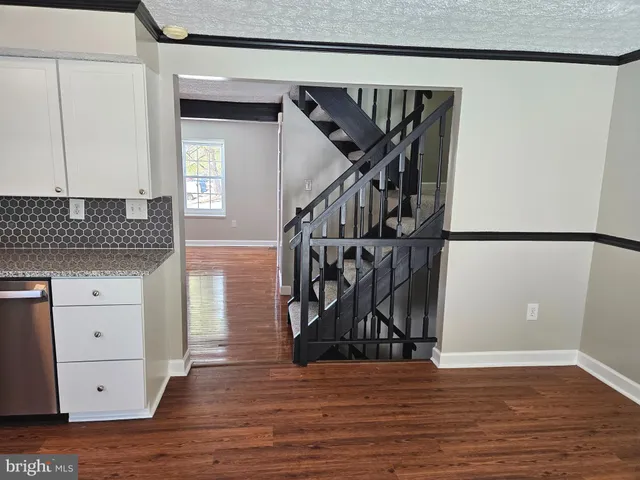 a view of front door and wooden floor