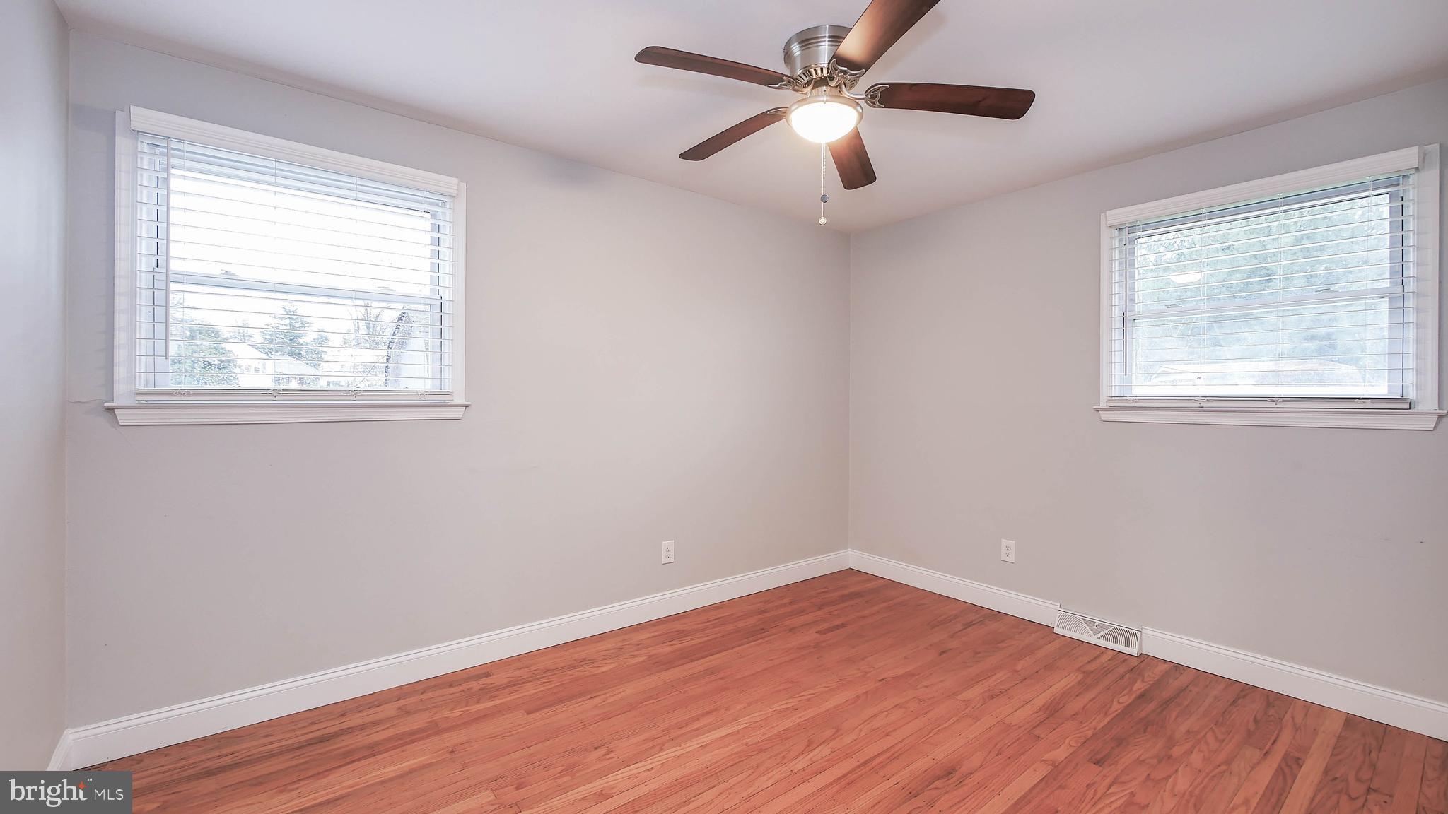 2 Clement Drive Somerdale, NJ 08083 - Photo 12 of 22 a view of empty room with wooden floor and fan