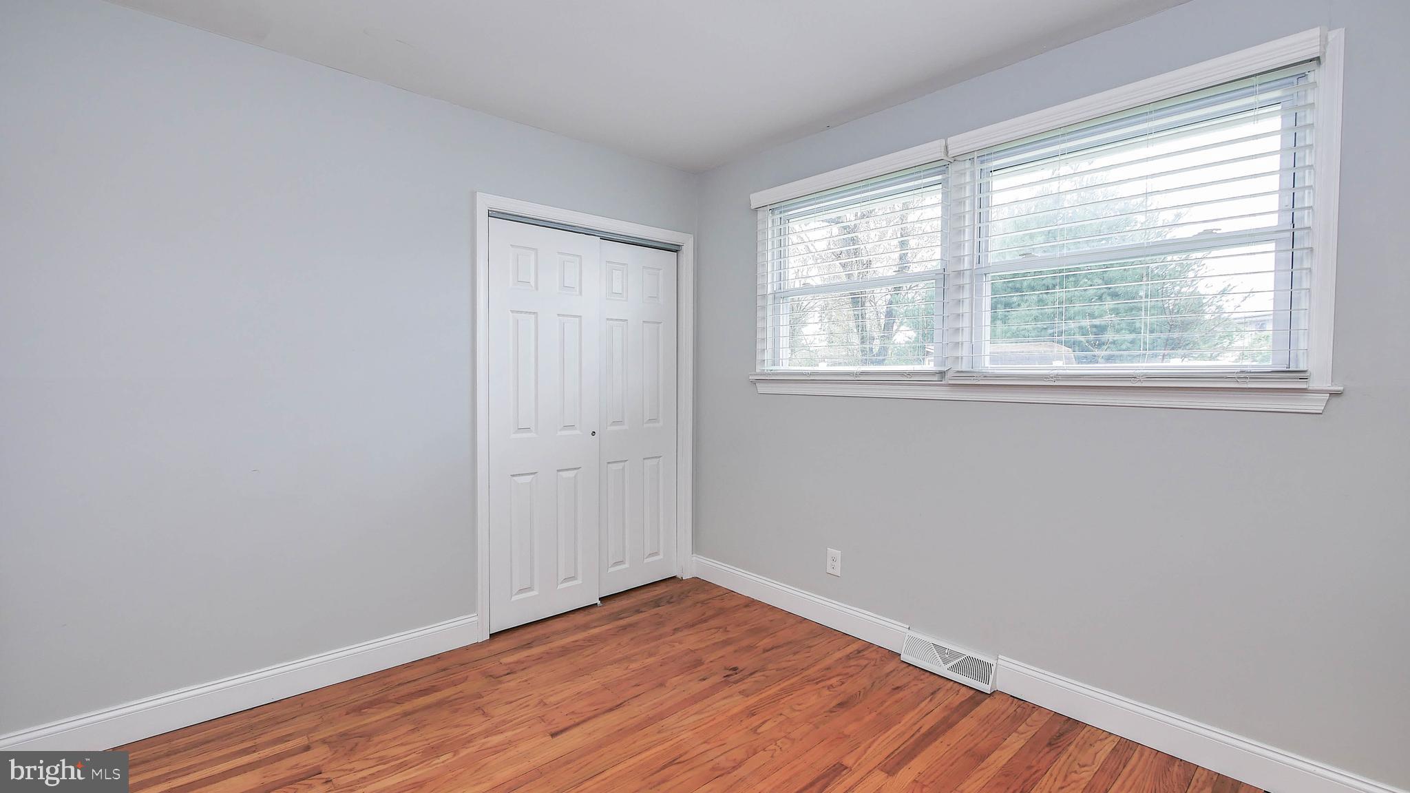 2 Clement Drive Somerdale, NJ 08083 - Photo 13 of 22 a view of an empty room with wooden floor and a window