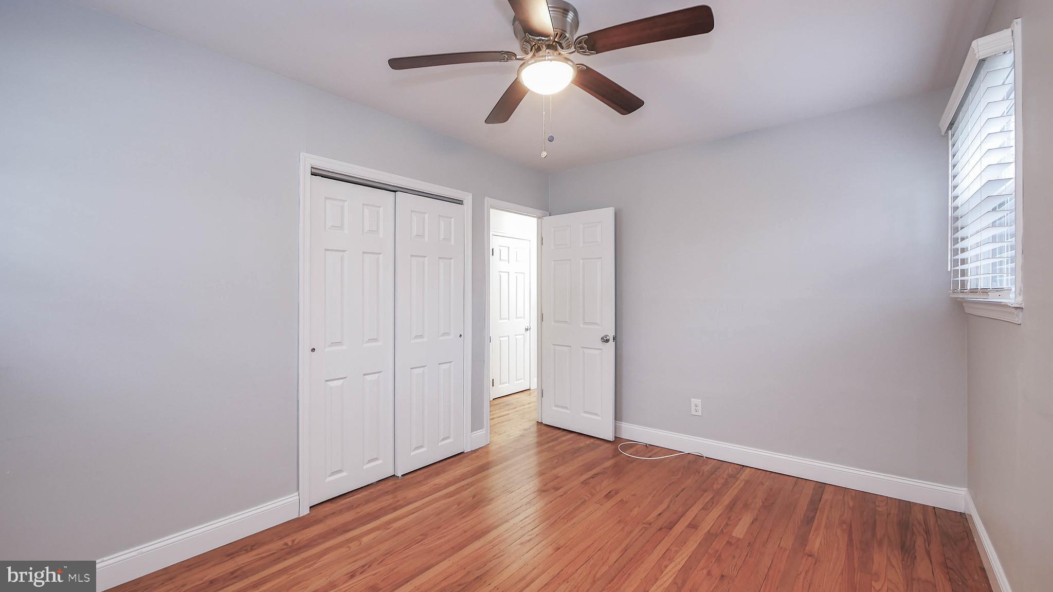 2 Clement Drive Somerdale, NJ 08083 - Photo 6 of 22 a view of empty room with wooden floor and fan
