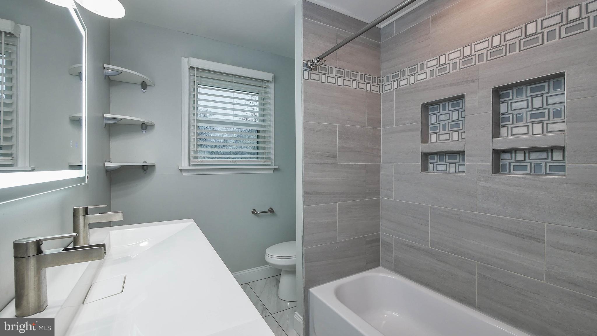2 Clement Drive Somerdale, NJ 08083 - Photo 10 of 22 a bathroom with a sink a toilet and shower