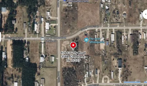 a street sign on a wall next to a building