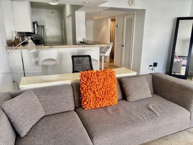 100 Lincoln Road, Unit 531 Miami Beach, FL 33139 - Photo 2 of 31 a living room with furniture and a fireplace