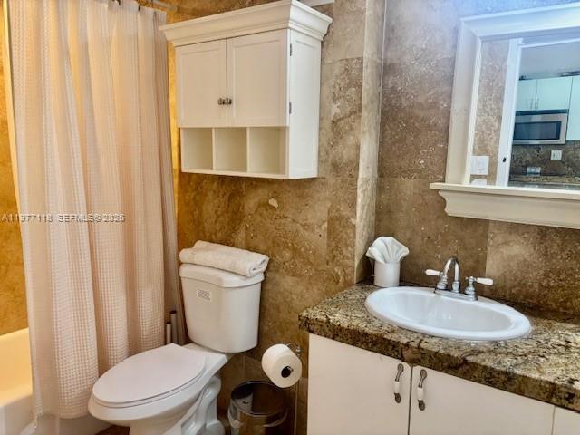 100 Lincoln Road, Unit 531 Miami Beach, FL 33139 - Photo 9 of 31 a bathroom with a granite countertop sink and a mirror