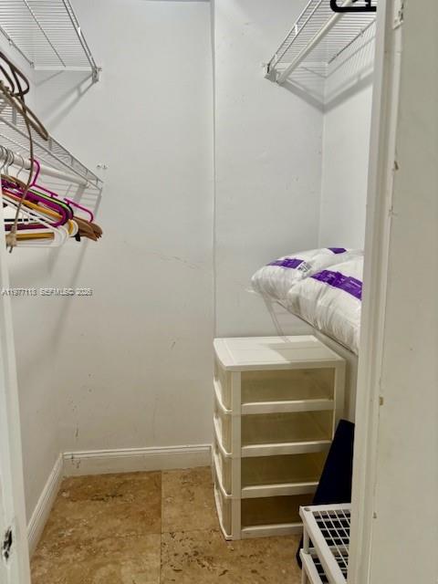 100 Lincoln Road, Unit 531 Miami Beach, FL 33139 - Photo 10 of 31 a view of walk in closet with clothes and shoes