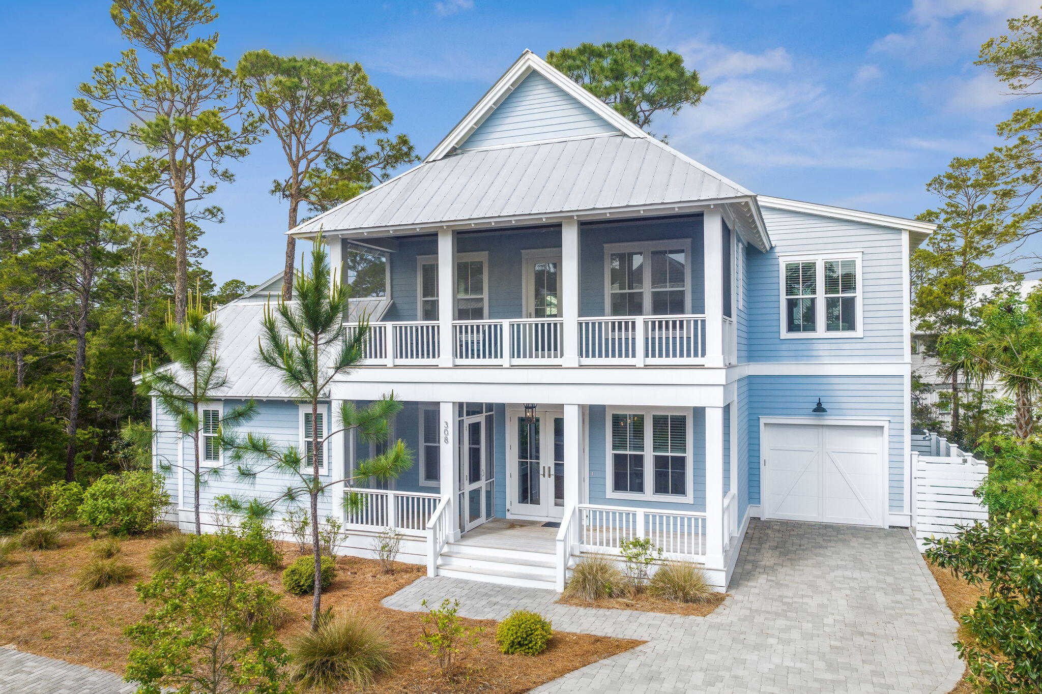 308 Matt's Way Santa Rosa Beach, FL 32459 - Photo 2 of 50 a front view of a house with a garden and plants
