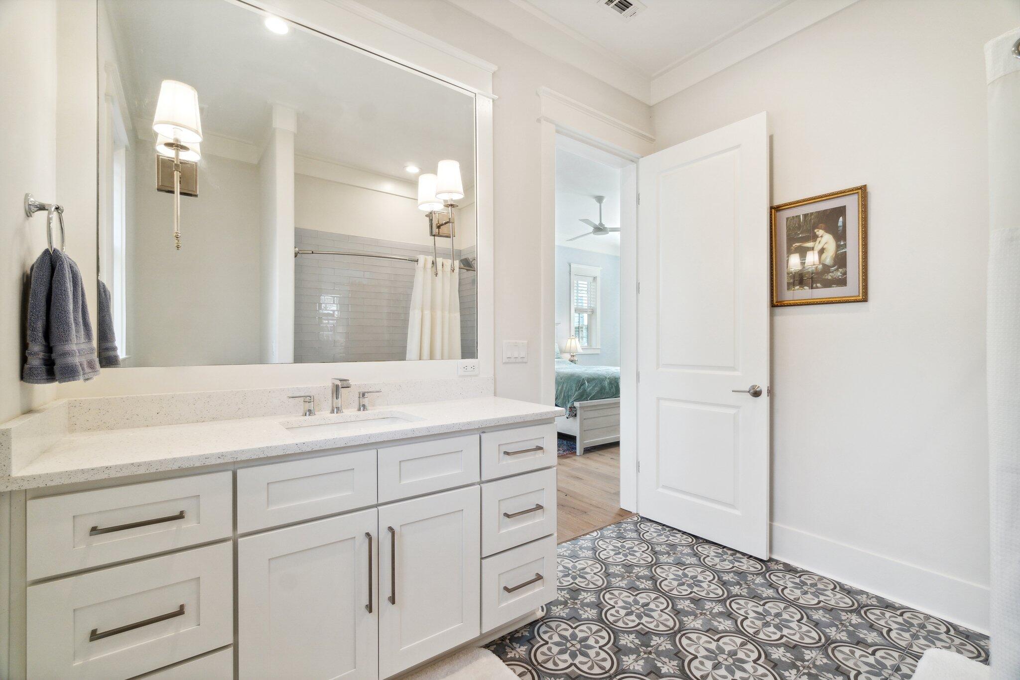 308 Matt's Way Santa Rosa Beach, FL 32459 - Photo 25 of 50 a bathroom with a double vanity sink mirror and shower