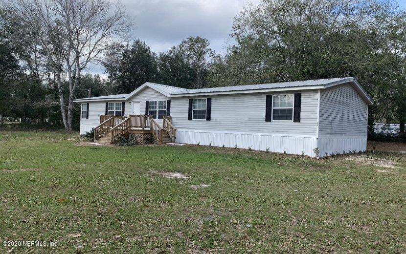 3980 Pinto Road Middleburg, FL 32068 - Photo 1 of 24 a front view of house with yard and green space