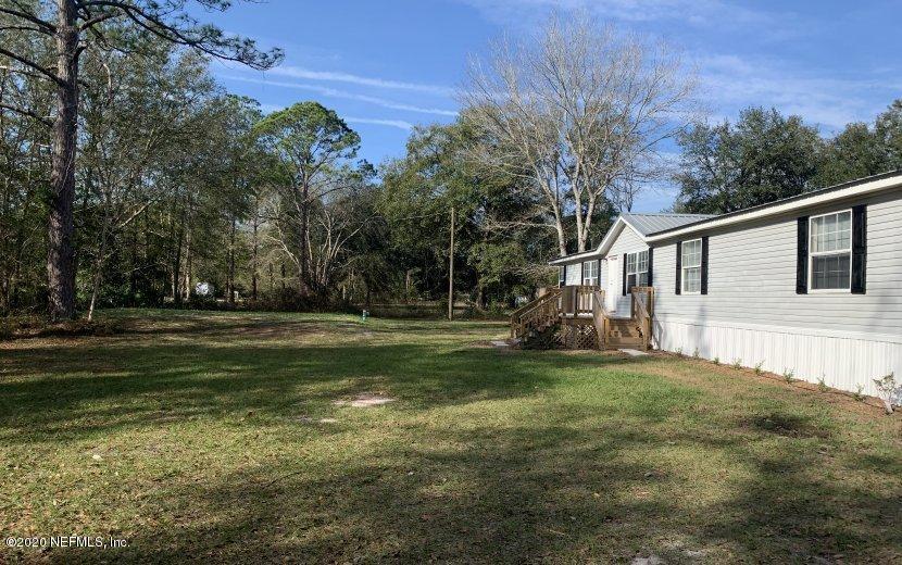 3980 Pinto Road Middleburg, FL 32068 - Photo 15 of 24 a view of a house with a yard