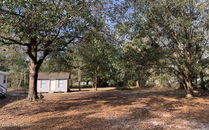 3980 Pinto Road Middleburg, FL 32068 - Photo 22 of 24 a view of a house with a tree in front