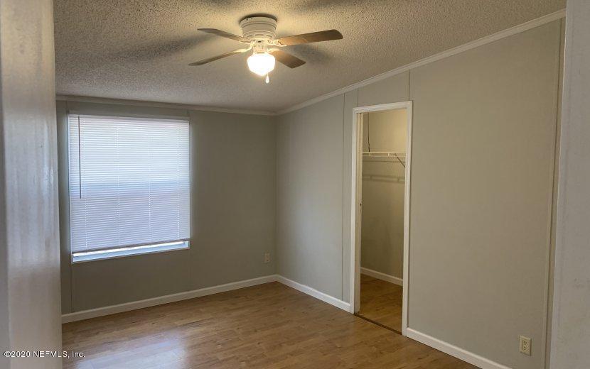3980 Pinto Road Middleburg, FL 32068 - Photo 8 of 24 an empty room with closet and a window