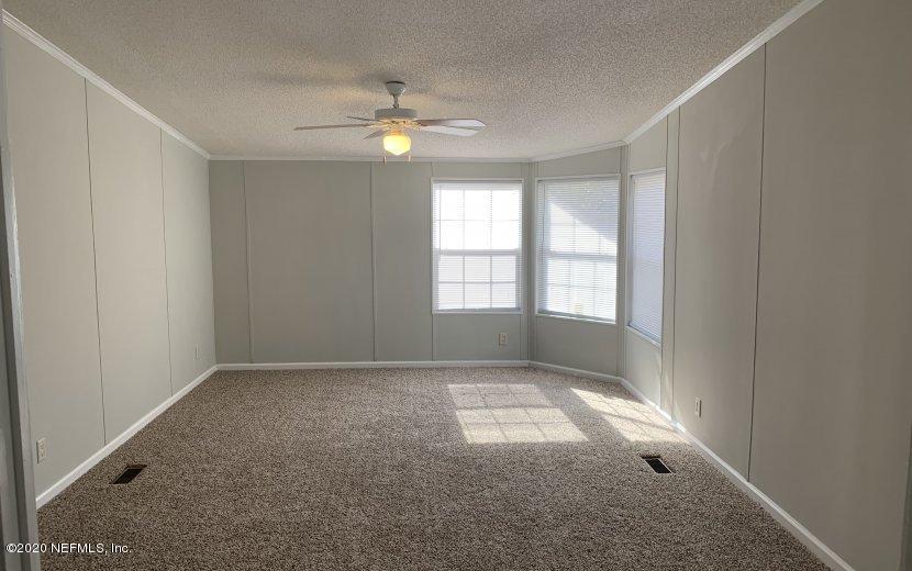 3980 Pinto Road Middleburg, FL 32068 - Photo 9 of 24 a view of an empty room with a window