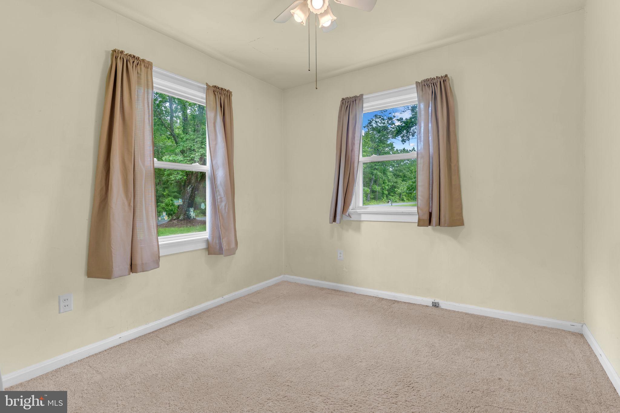 2159 Mathias Point Road King George, VA 22485 - Photo 11 of 22 an empty room with windows and closet