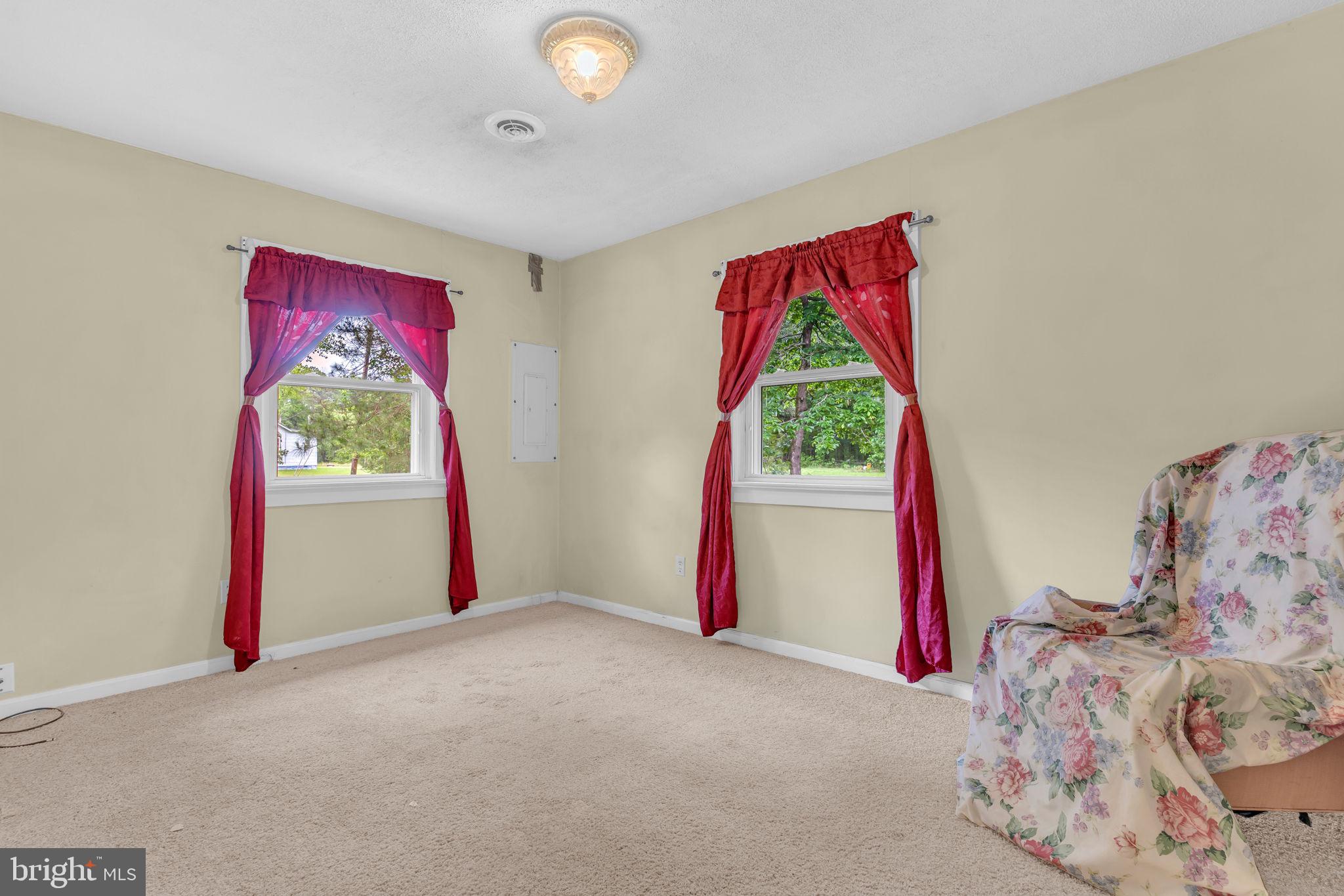 2159 Mathias Point Road King George, VA 22485 - Photo 13 of 22 a view of a bedroom with baby bed and a window