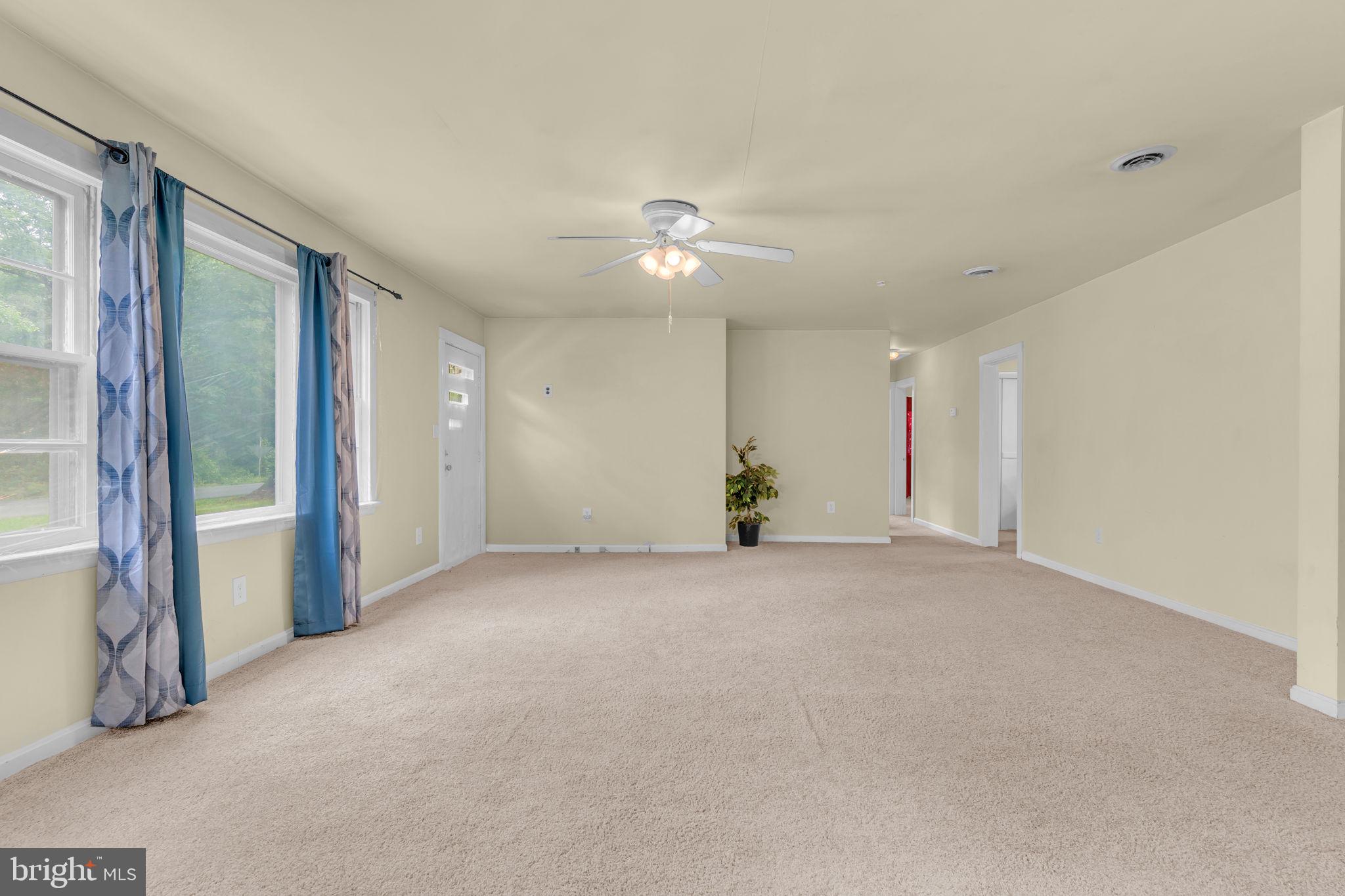 2159 Mathias Point Road King George, VA 22485 - Photo 3 of 22 a view of a room with a ceiling fan and window