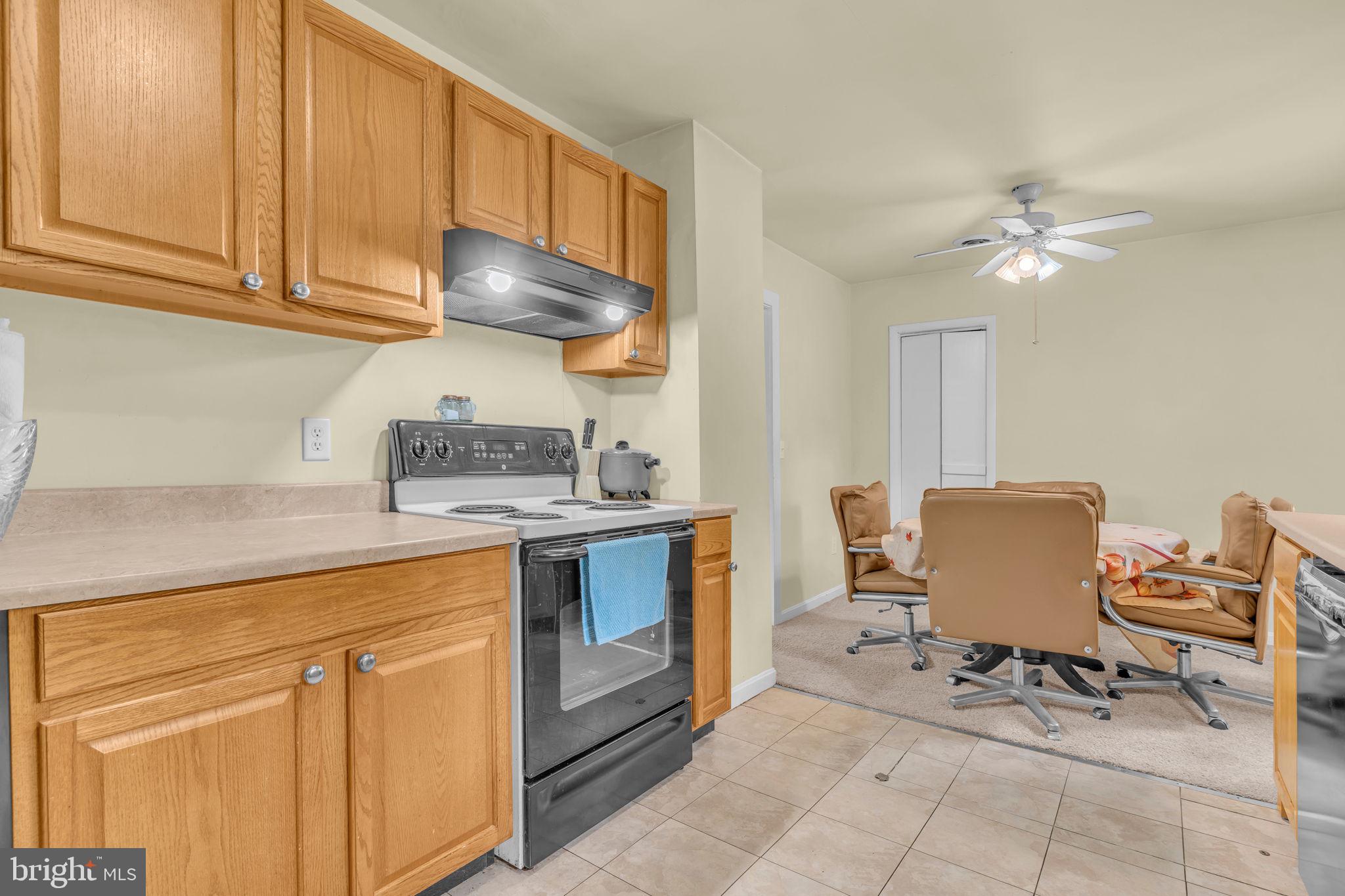 2159 Mathias Point Road King George, VA 22485 - Photo 9 of 22 a kitchen with stainless steel appliances granite countertop a stove a sink and a microwave