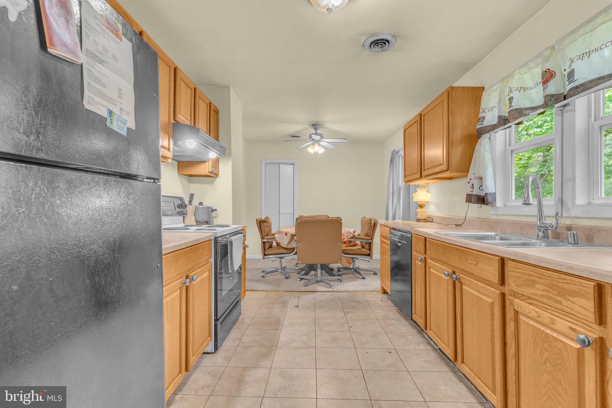 2159 Mathias Point Road King George, VA 22485 - Photo 10 of 22 a large white kitchen with a large window