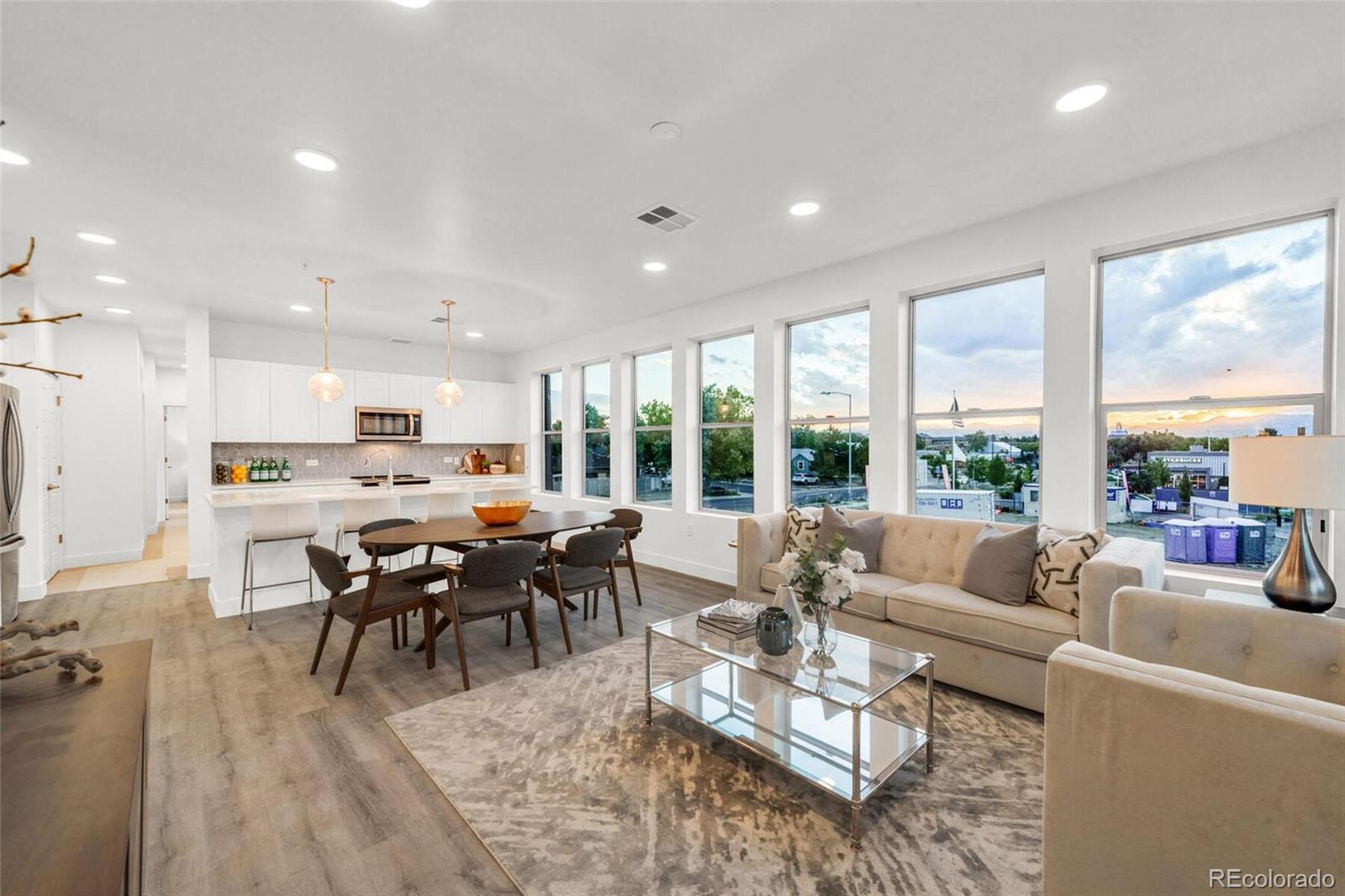 2899 West 52nd Avenue, Unit 301 Denver, CO 80221 - Photo 14 of 16 a living room with furniture wooden floor and a large window
