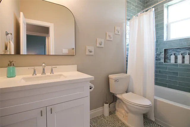 a bathroom with a toilet and a bathtub